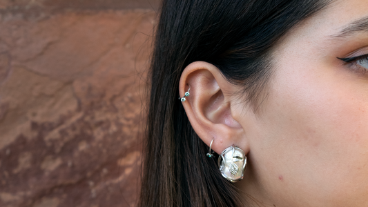 silver earring on model closeup